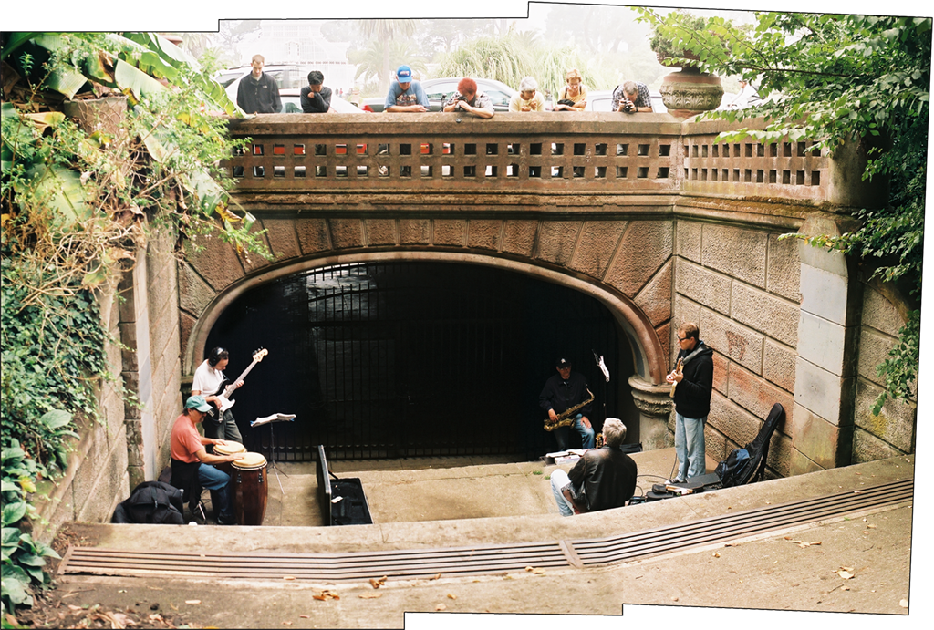 Five piece band practices under a bridge in Golden Gate Park, San Francisco